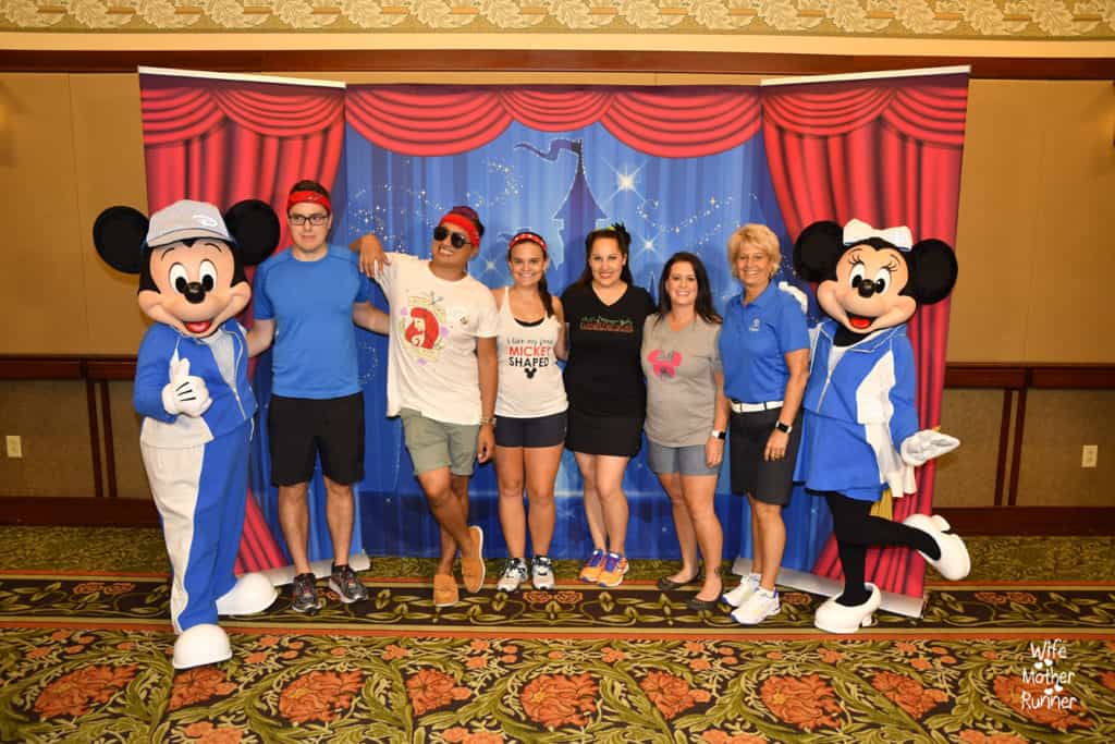 Team Mickey getting photos with Mickey and Minnie Mouse